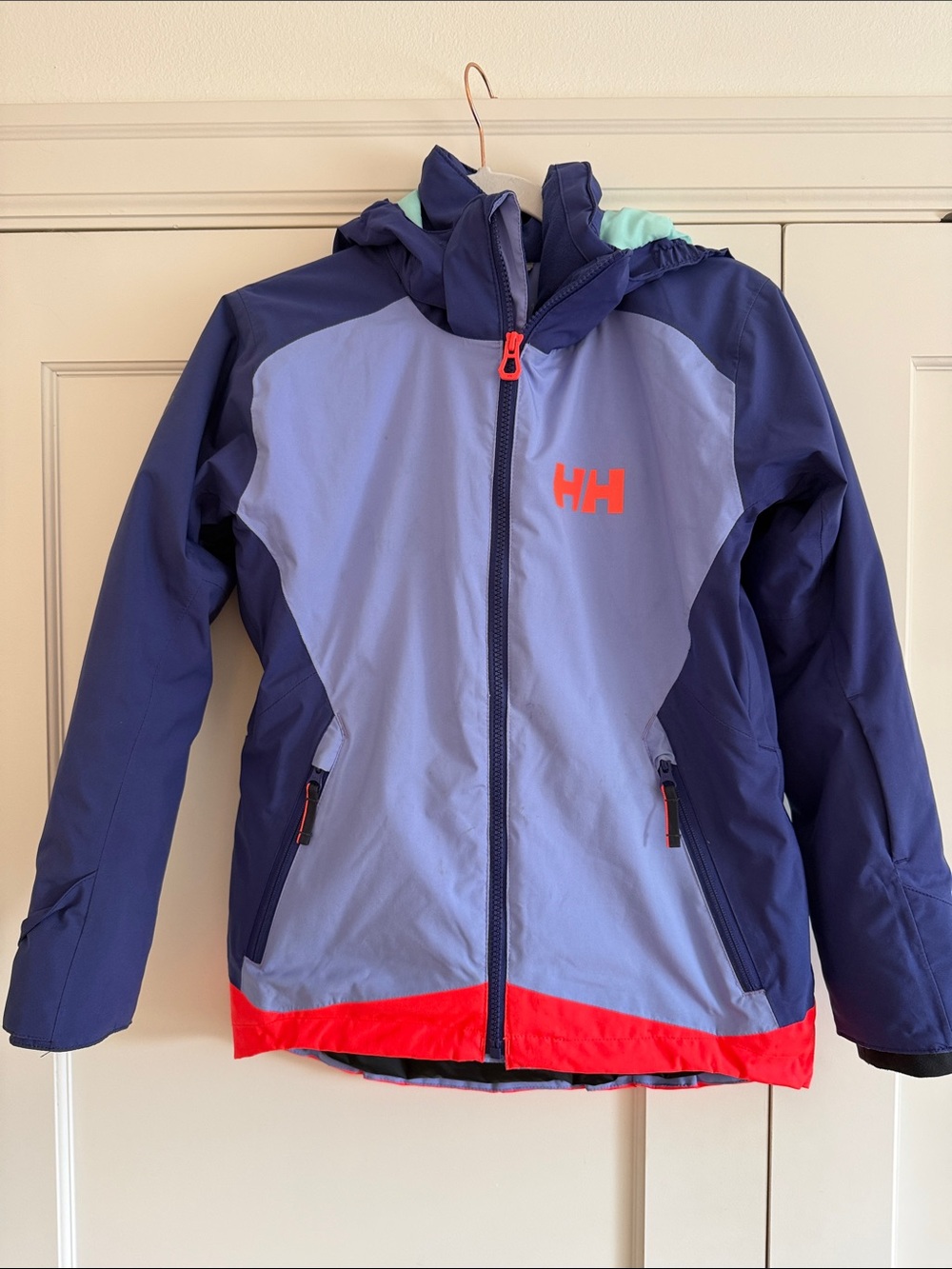 Helly Hansen Kid’s Shredder’s Ski Jacket. Lavender and purple with neon trim.